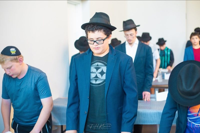 Meir davening at shul